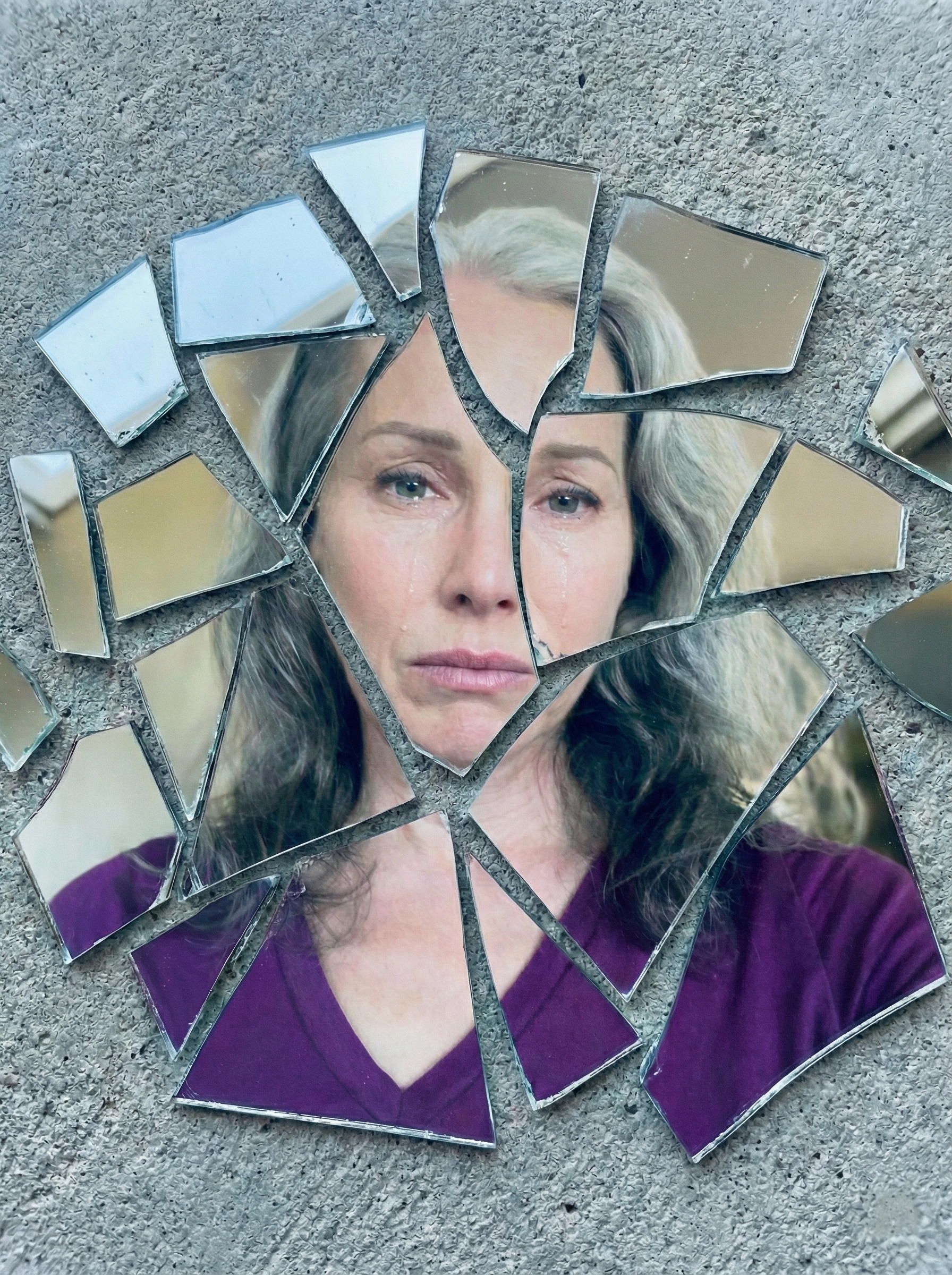 Conceptual shattered-mirror portrait representing the fragmented experience of living with complex chronic illness.